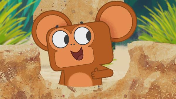 Der kleine Affe freut sich über seine neue Sandburg. | Rechte: KiKA/Dog Loves Productions Limited 2020