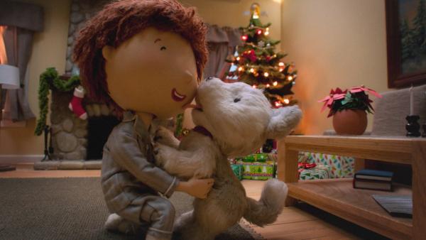 Andrews größter Weihnachtswunsch geht in Erfüllung: Endlich kann er Jingle in seine Arme schließen. | Rechte: KiKA/2011 Hallmark Licensing, Inc.