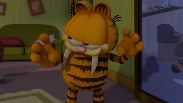 Garfield, als Katzilla verkleidet, erschreckt etliche Nachbarn fast zu Tode. | Rechte: HR/DARGAUD MEDIA