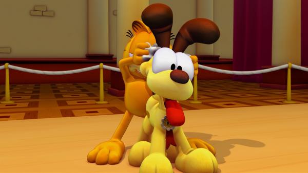 Garfield beschließt, dass Odie beim Wettbewerb mitmachen soll und ernennt sich zu seinem Manager. | Rechte: HR/DARGAUD MEDIA