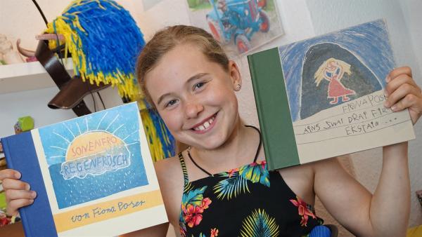 Die neunjährige Fiona liebt alles was Kreativ ist. Seit dem Kindergarten geht sie jede Woche zu den "Buchkindern". | Rechte: MDR/Cine Impuls/Martin Reißmann