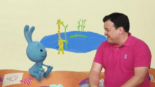 Giraffe Gerda und der Strohhalm-Trick | Rechte: KiKA KiKANiNCHEN und Christian beobachten eine Giraffe am See.