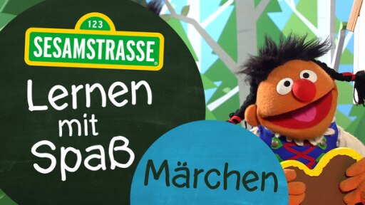 Ernie als Gretel mit Logo