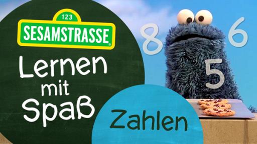 Das Krümelmonster mit dem Logo "Lernen mit Spaß"