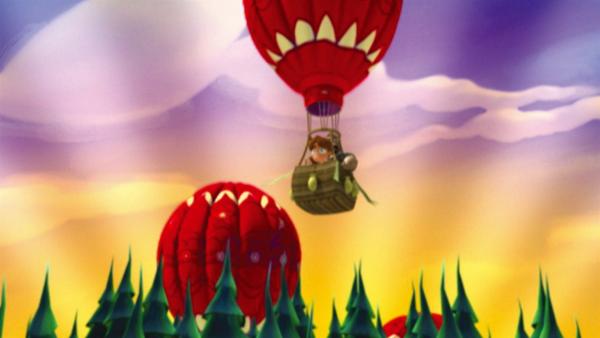 Tommy schwebt im Heißluftballon und ahnt noch nicht, was dieser Anblick bei seinen Alien-Freunden auslöst. | Rechte: KiKA/Taffy Prod.