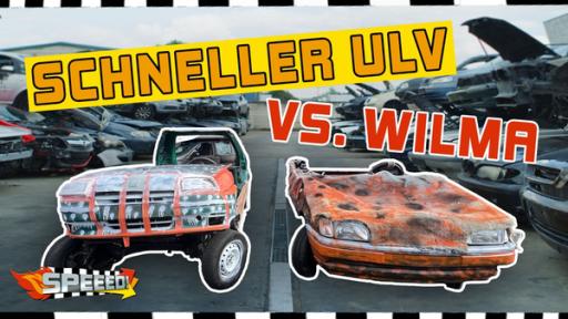 Eine Bildmontage. Zwei ramponierte Autos stehen nebeneinander auf einer Straße. Darüber in gelber Schrift "Schneller ULV vs. Wilma". Unten links das Logo von "Speeed".