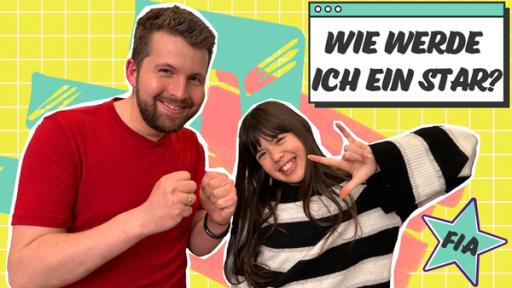 Links Tim in einem rotem T-Shirt. Er drückt FIA die Daumen. Sie steht links neben ihm und lächelt. Rechts oben eine Tafel mit der Frage: Wie werde ich ein Star?